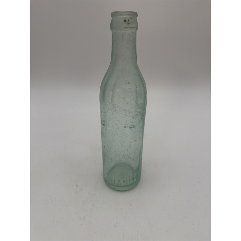 aqua-tinted glass bottle with visible bubbles Seattle Juanita